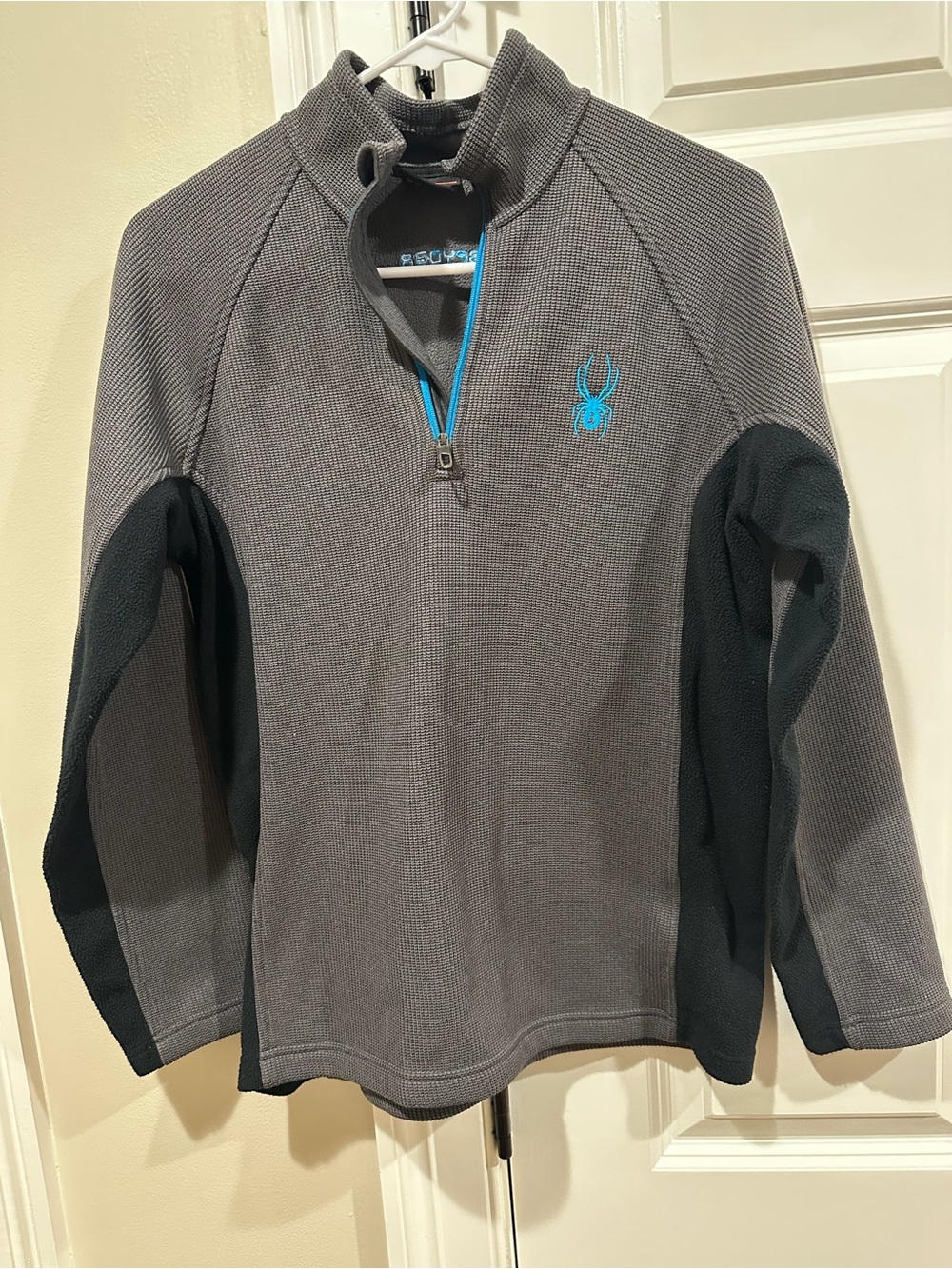 Spyder kid’s Gray and Black Half-Zip Performance Jacket with Teal Logo